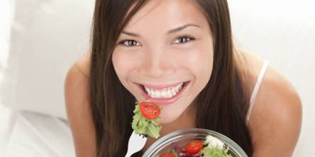 Happy Woman Eating Salads